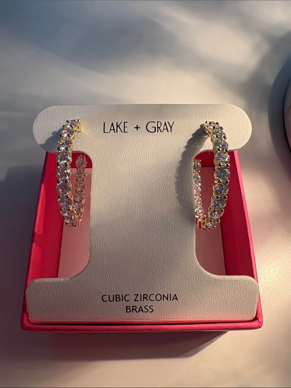 New in box Lake and Gray Gold/CZ Stone earrings
